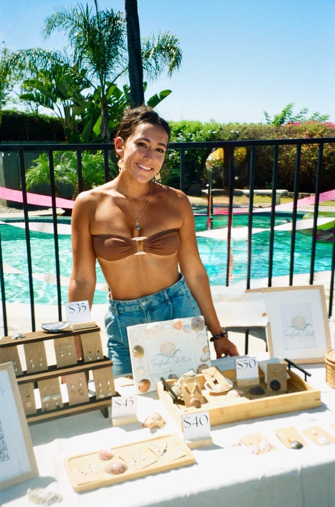 Surfside Shells jewelry displayed at a poolside market